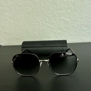 Brand new Prada sunglasses! Black/gold SPR67X with nose pads. Size 58-19-145